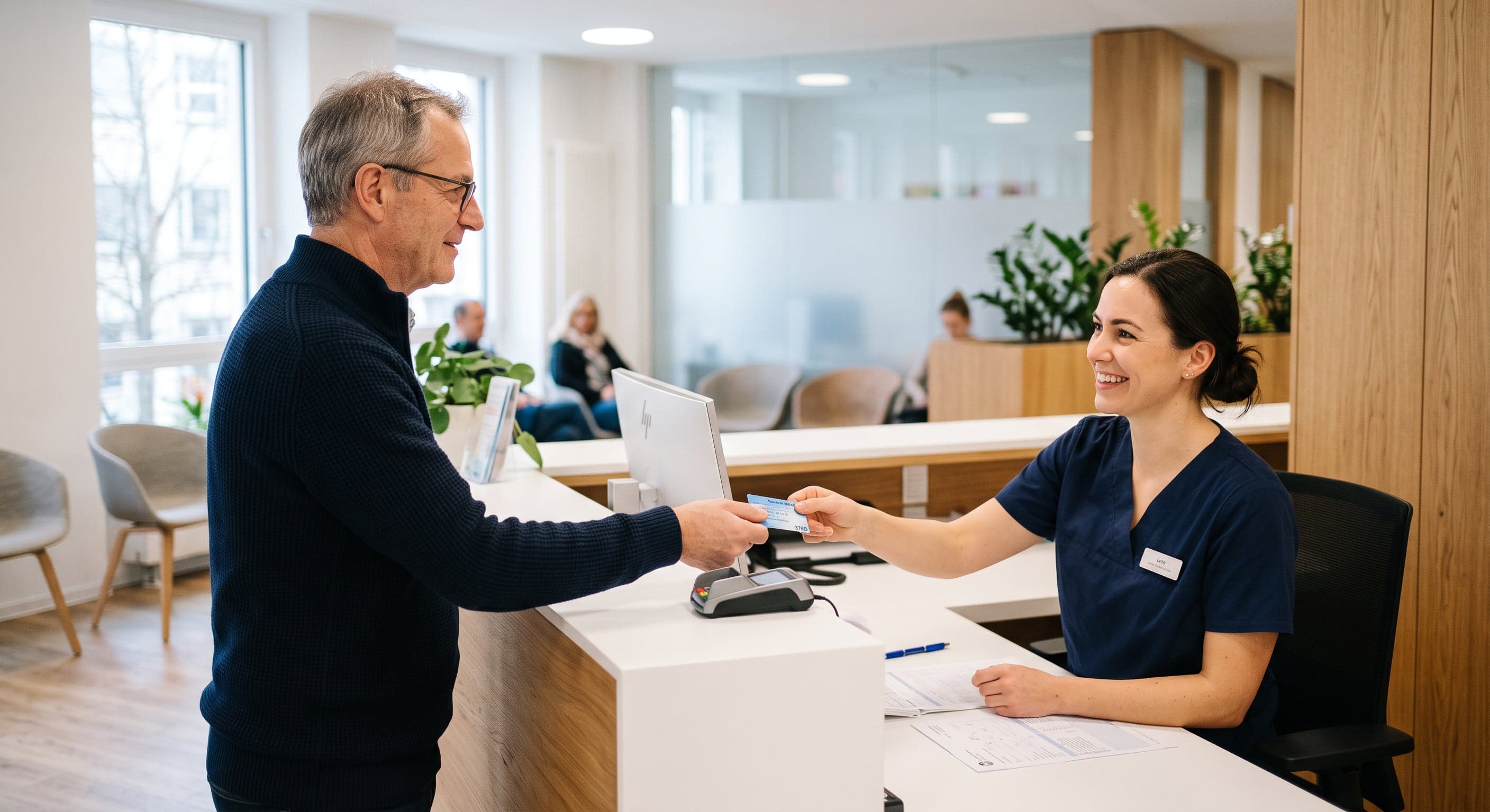 A patient handing an insurance card to a clinic receptionist